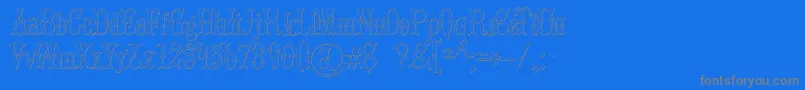 BrucedoublepicaBeveled-Schriftart – Graue Schriften auf blauem Hintergrund