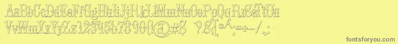 BrucedoublepicaBeveled Font – Gray Fonts on Yellow Background