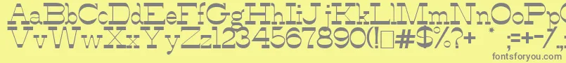 AlfredosDance-fontti – harmaat kirjasimet keltaisella taustalla