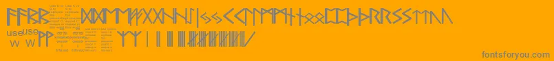 PaulsRealCelticRuneFont-Schriftart – Graue Schriften auf orangefarbenem Hintergrund