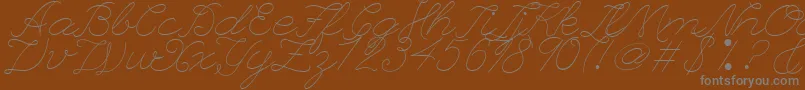 フォントLeagueScriptThinLeagueScript – 茶色の背景に灰色の文字