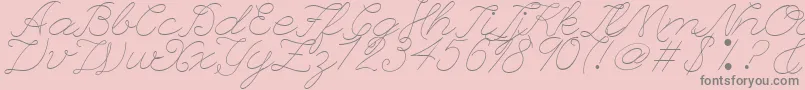 LeagueScriptThinLeagueScript-fontti – harmaat kirjasimet vaaleanpunaisella taustalla