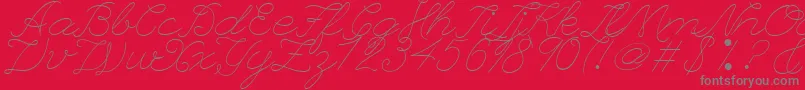 LeagueScriptThinLeagueScript-Schriftart – Graue Schriften auf rotem Hintergrund