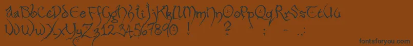 HobbitonHandscrawlRegular Font – Black Fonts on Brown Background