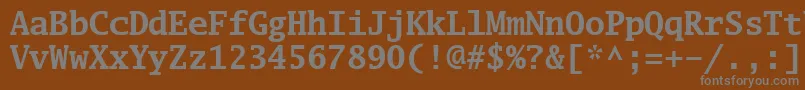 Luximb-fontti – harmaat kirjasimet ruskealla taustalla