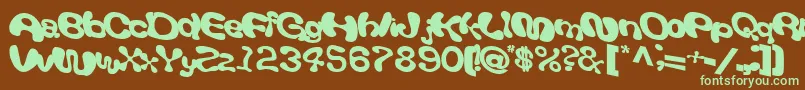 フォントGiveandtake18Bold – 緑色の文字が茶色の背景にあります。