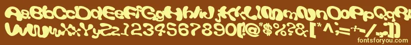 Giveandtake18Bold-fontti – keltaiset fontit ruskealla taustalla