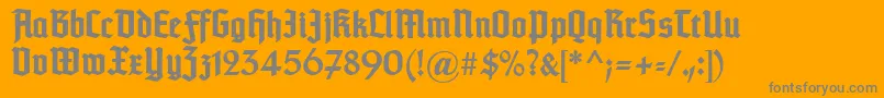 フォントTypographertexturunz1Bold – オレンジの背景に灰色の文字