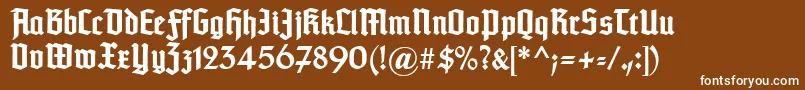Czcionka Typographertexturunz1Bold – białe czcionki na brązowym tle