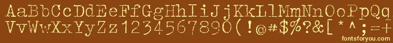 Tippa-fontti – keltaiset fontit ruskealla taustalla