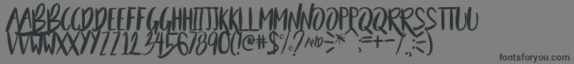BeautyAndTheBeastSample Font – Black Fonts on Gray Background