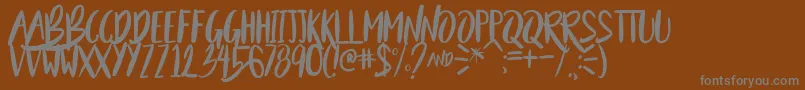 BeautyAndTheBeastSample-Schriftart – Graue Schriften auf braunem Hintergrund