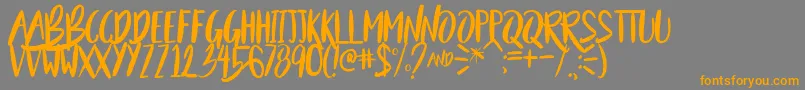 BeautyAndTheBeastSample-Schriftart – Orangefarbene Schriften auf grauem Hintergrund