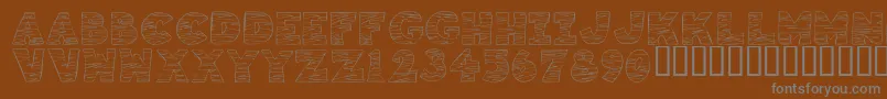 Подробнее о шрифте KrTigrrr Шрифт KrTigrrr – серые шрифты на коричневом фоне