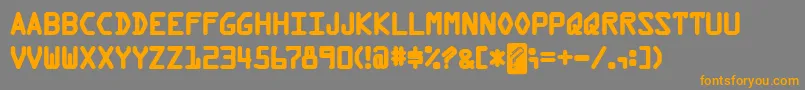 フォントKreditBack – オレンジの文字は灰色の背景にあります。