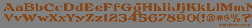 フォントFhaefcanEccentricFrenchFreeware – 茶色の文字が灰色の背景にあります。