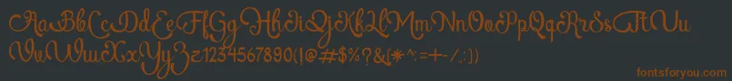 Шрифт AtlantisHeartFree – коричневые шрифты на чёрном фоне