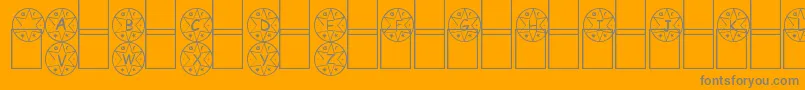 Medalha-fontti – harmaat kirjasimet oranssilla taustalla