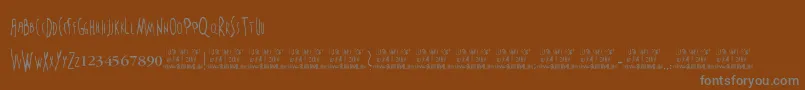 TheSixthSense-fontti – harmaat kirjasimet ruskealla taustalla