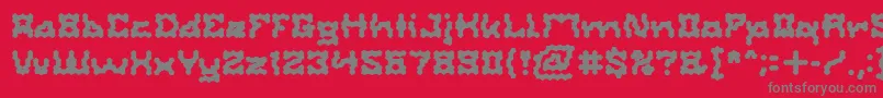 フォントShakeItOffBold – 赤い背景に灰色の文字