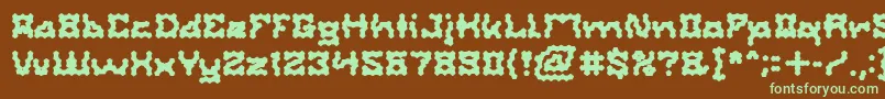 フォントShakeItOffBold – 緑色の文字が茶色の背景にあります。