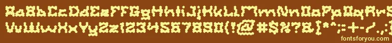 ShakeItOffBold-fontti – keltaiset fontit ruskealla taustalla