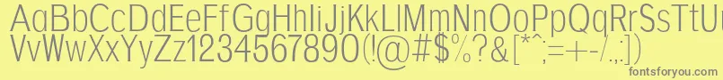 AgajdaRegular-fontti – harmaat kirjasimet keltaisella taustalla