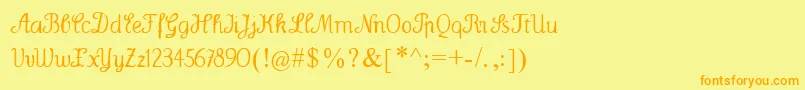 フォントWenceslas – オレンジの文字が黄色の背景にあります。