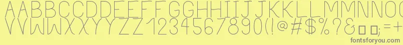 PhilippineLight-Schriftart – Graue Schriften auf gelbem Hintergrund