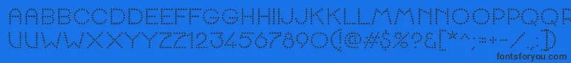 K22SpottyFace Font – Black Fonts on Blue Background