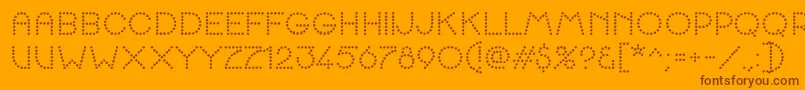 K22SpottyFace Font – Brown Fonts on Orange Background