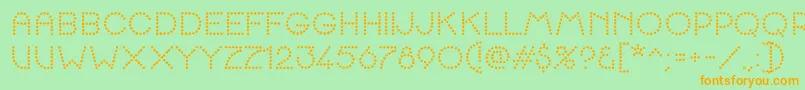 K22SpottyFace Font – Orange Fonts on Green Background