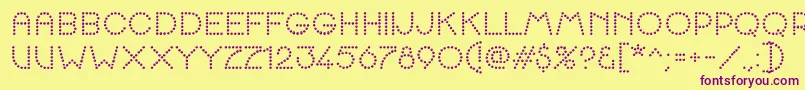 K22SpottyFace Font – Purple Fonts on Yellow Background