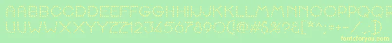 K22SpottyFace Font – Yellow Fonts on Green Background