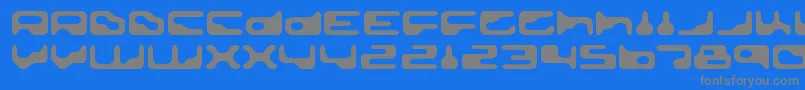 GoldengirdleRegular-fontti – harmaat kirjasimet sinisellä taustalla