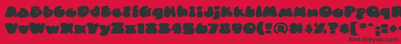 DuncecapbbReg Font – Black Fonts on Red Background