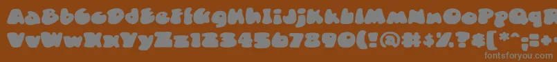 DuncecapbbReg Font – Gray Fonts on Brown Background