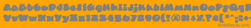 フォントDuncecapbbReg – オレンジの背景に灰色の文字