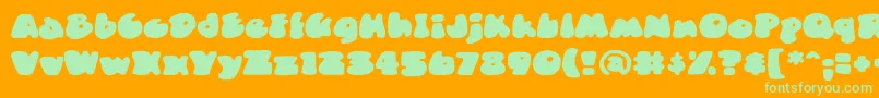 DuncecapbbReg-Schriftart – Grüne Schriften auf orangefarbenem Hintergrund