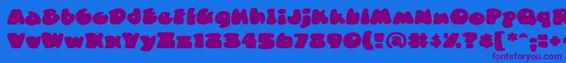 DuncecapbbReg Font – Purple Fonts on Blue Background