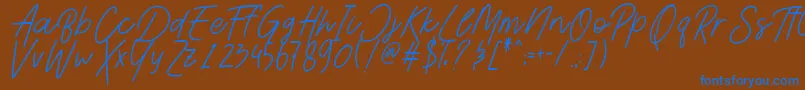 Шрифт AesthetikScriptDemo – синие шрифты на коричневом фоне