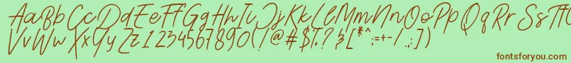 Шрифт AesthetikScriptDemo – коричневые шрифты на зелёном фоне