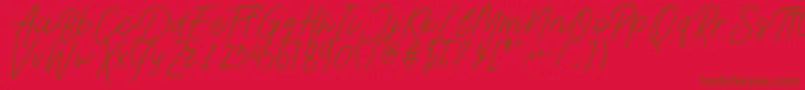 フォントAesthetikScriptDemo – 赤い背景に茶色の文字