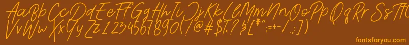 Шрифт AesthetikScriptDemo – оранжевые шрифты на коричневом фоне