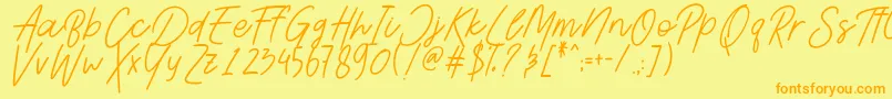 フォントAesthetikScriptDemo – オレンジの文字が黄色の背景にあります。