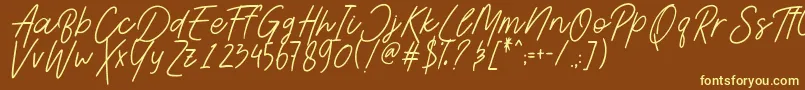 Шрифт AesthetikScriptDemo – жёлтые шрифты на коричневом фоне