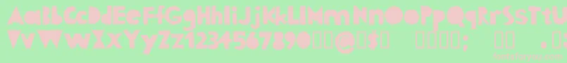 Fonte FabricshapesRegular – fontes rosa em um fundo verde