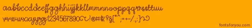 Fonte LightheartScriptRegular – fontes marrons em um fundo laranja