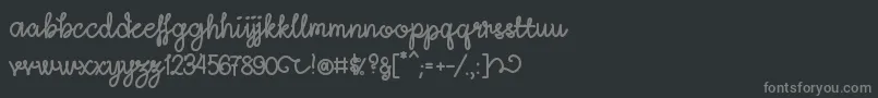 LightheartScriptRegular-fontti – harmaat kirjasimet mustalla taustalla
