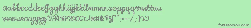 フォントLightheartScriptRegular – 緑の背景に灰色の文字